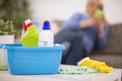 Cleaner using safety procedures during carpet cleaning in Tottenham Green